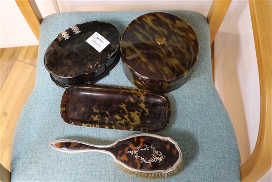 A silver and tortoiseshell harlequin dressing table set with related jars, dishes, etc.